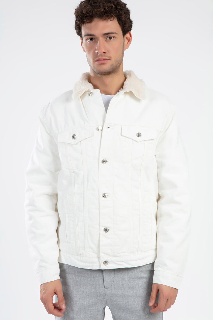 Man in Carbon Jeans Ashton white denim jacket with faux-fur collar, urban streetwear style for men.
