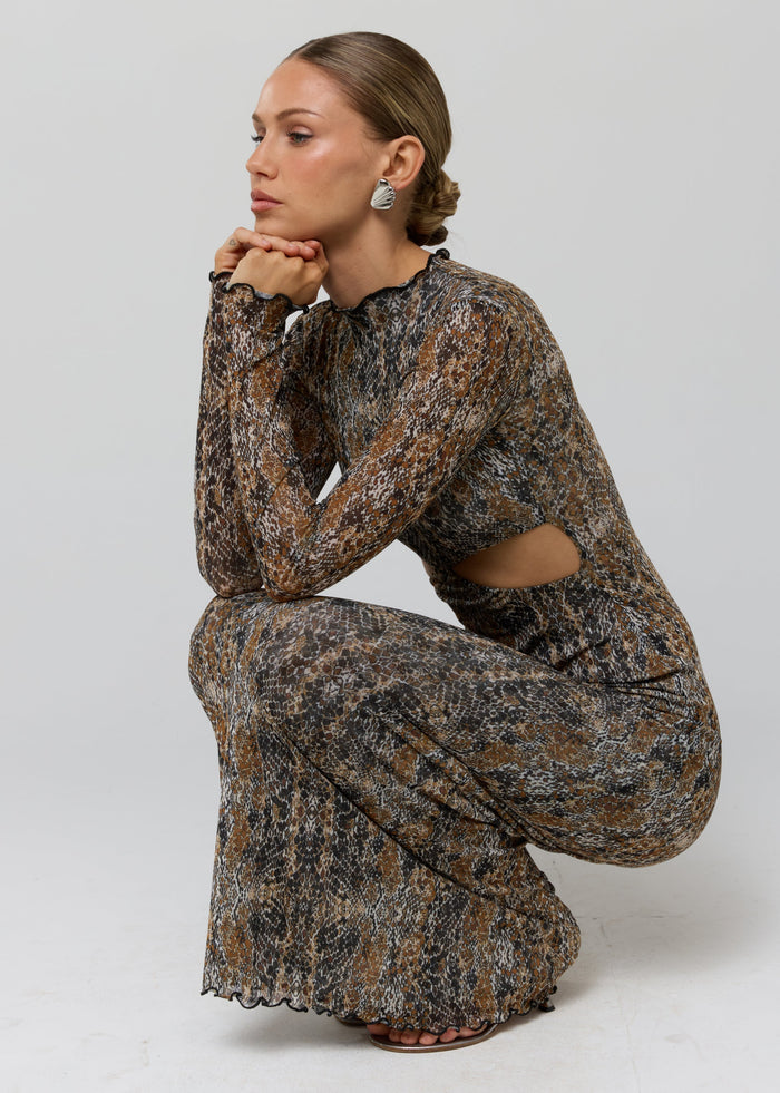 This is an image of Audrey Dress in Serpent - RESA featuring a model wearing the dress