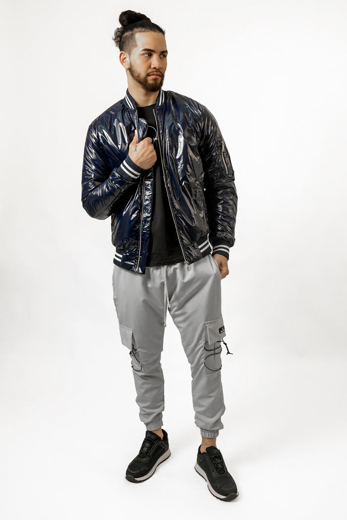 Axel modern blue glossy bomber jacket for men featuring ribbed trim and metallic finish on a studio model.