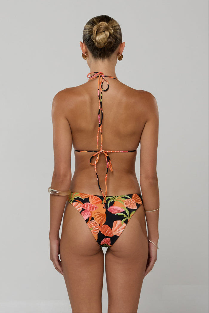 This is an image of Beau Bikini Bottom in Conch - RESA featuring a model wearing the dress