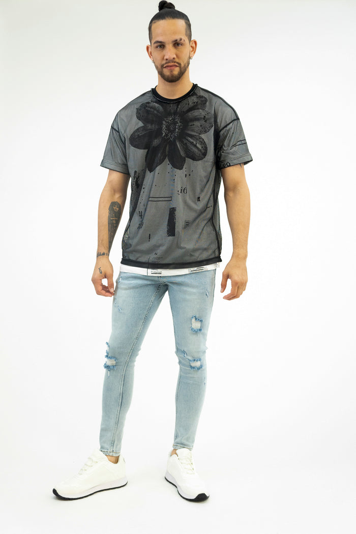 Model wearing Bobby Light Blue Super Skinny Fit Jeans with distressed knees and a light wash streetwear finish.