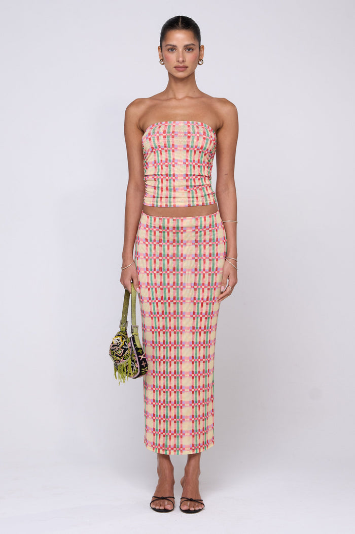 This is an image of Clyde Mesh Skirt in Plaid - RESA featuring a model wearing the dress