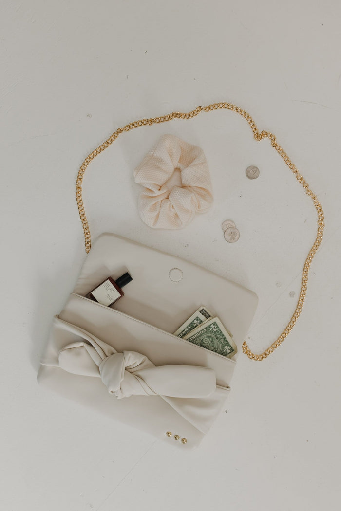BOW CONVERTIBLE CLUTCH 3 - IN - 1 STATEMENT BAG IN CREAM - Love Marlow
