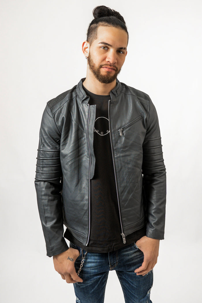 Man in Bradley dark blue denim-style leather jacket with ribbed shoulders and sleeve detailing.