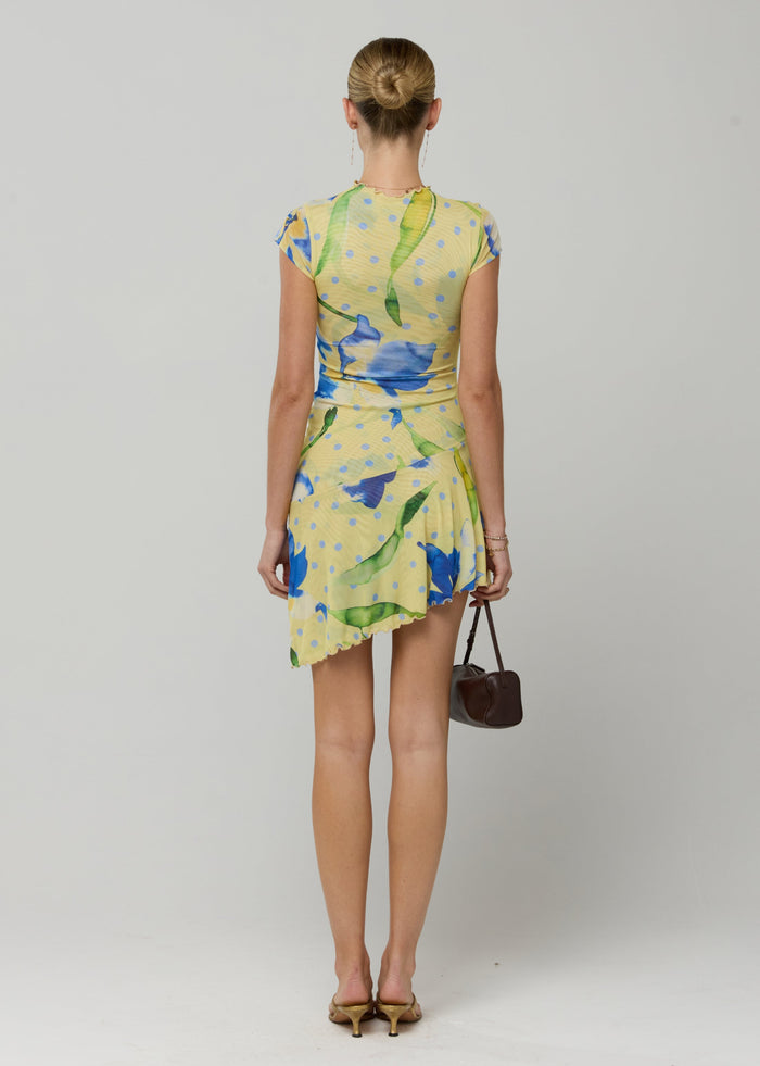 This is an image of Cece Dress in Solei - RESA featuring a model wearing the dress