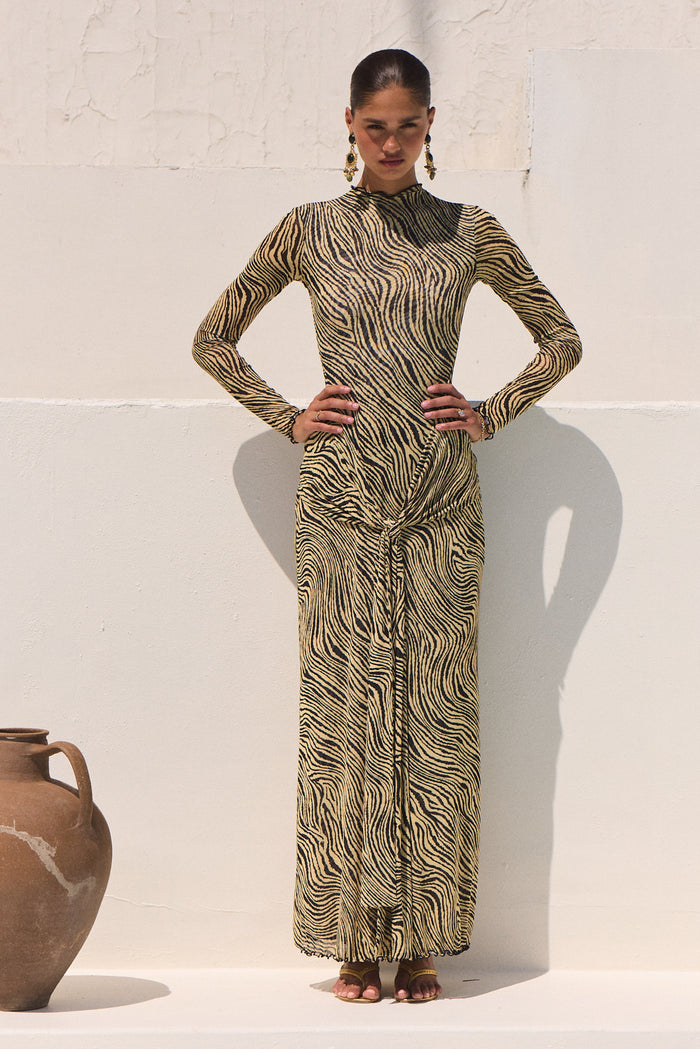This is an image of Dani Dress in Birch - RESA featuring a model wearing the dress