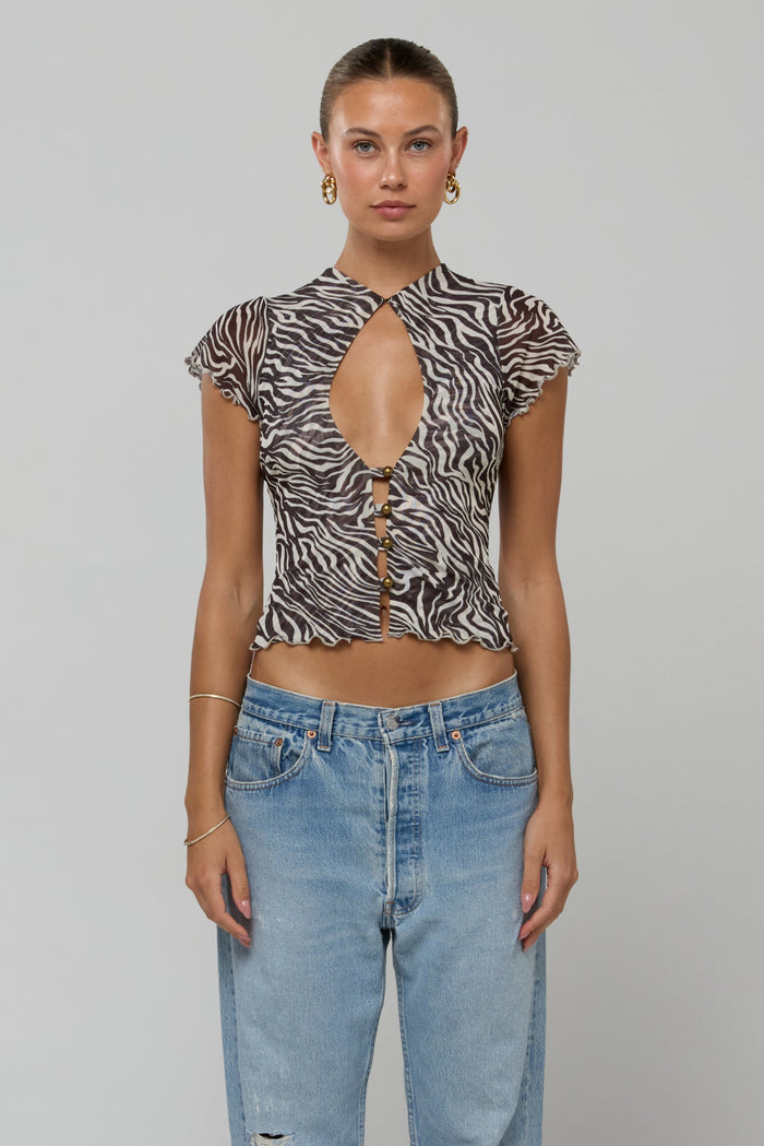 This is an image of Desi Top in Selva - RESA featuring a model wearing the dress