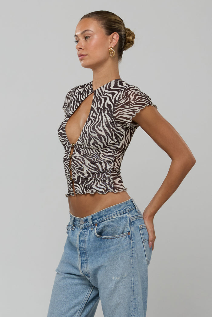 This is an image of Desi Top in Selva - RESA featuring a model wearing the dress