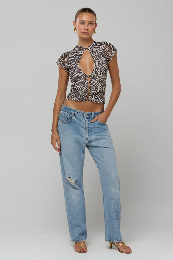 This is an image of Desi Top in Selva - RESA featuring a model wearing the dress