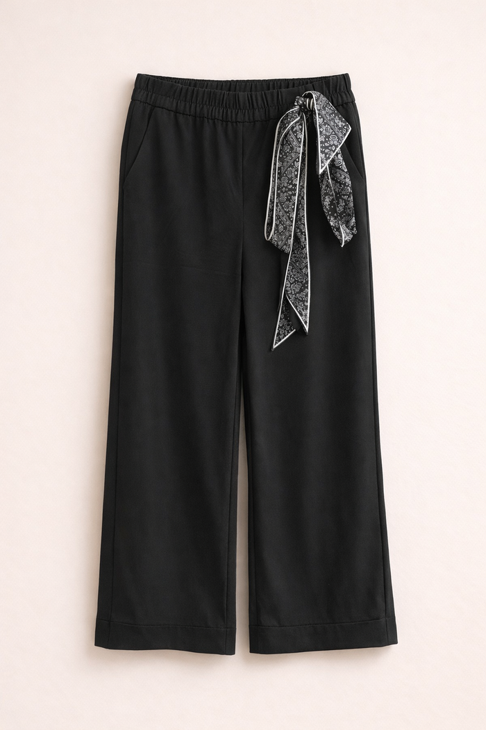 Black wide-leg pants with a decorative ribbon.