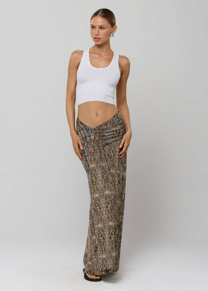 This is an image of Estelle Skirt in Serpent - RESA featuring a model wearing the dress