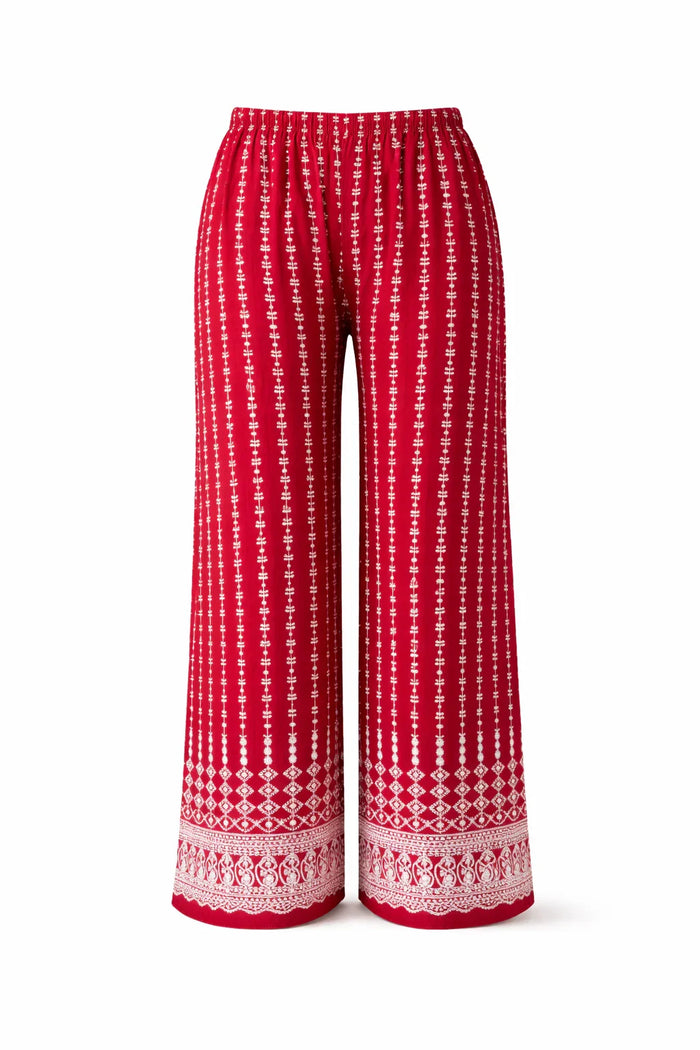 Red wide-leg pants with white vertical boho print and intricate border pattern