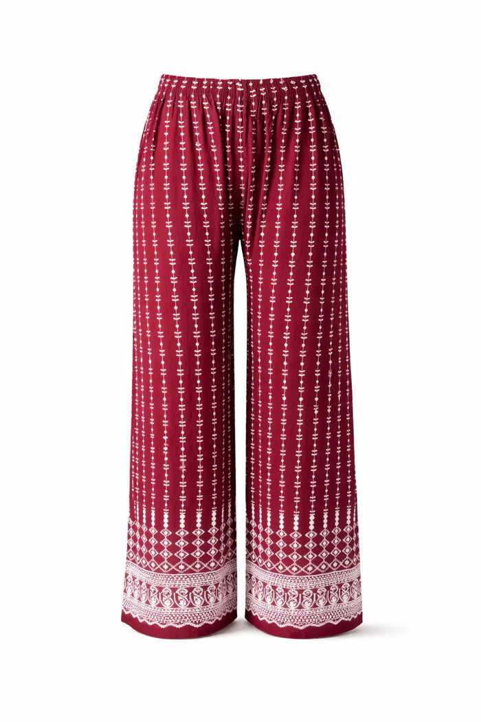 Red wide-leg pants with white ethnic print and elastic waistband, boho style