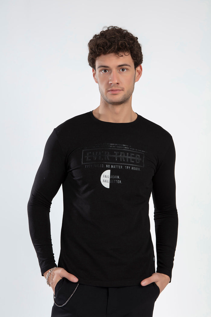Model wearing Ever Tried black long sleeve graphic shirt with urban streetwear text on a white studio background.