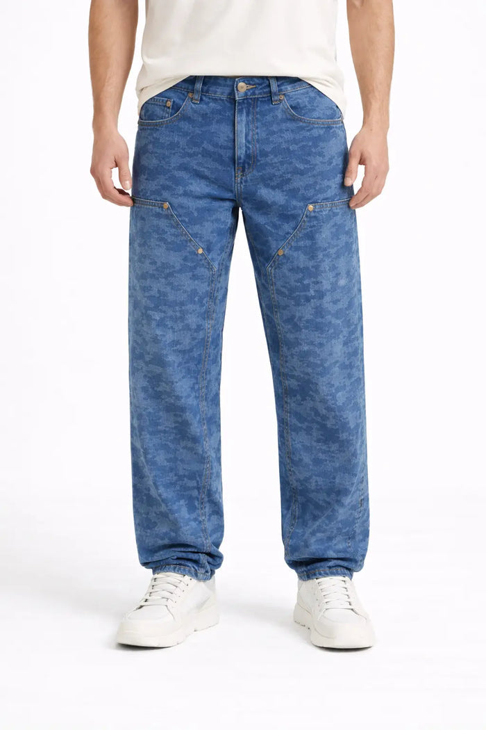 Casual blue camo-patterned pants with a relaxed fit, styled with a white t-shirt and sneakers.