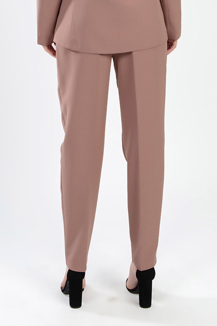 Rear view of the Fiona Jacket Set in Wild Mushroom featuring tailored trousers and a matching jacket with black heels.