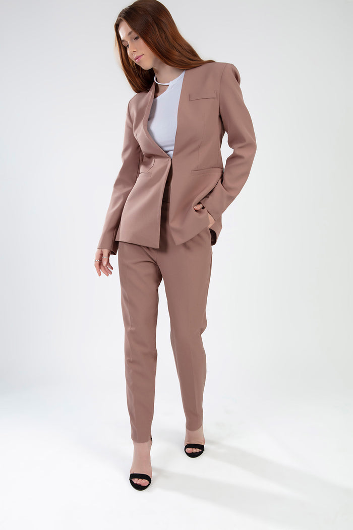 Model wearing the Fiona Pants Set in Wild Mushroom, featuring a tailored blazer and matching slim-fit trousers.