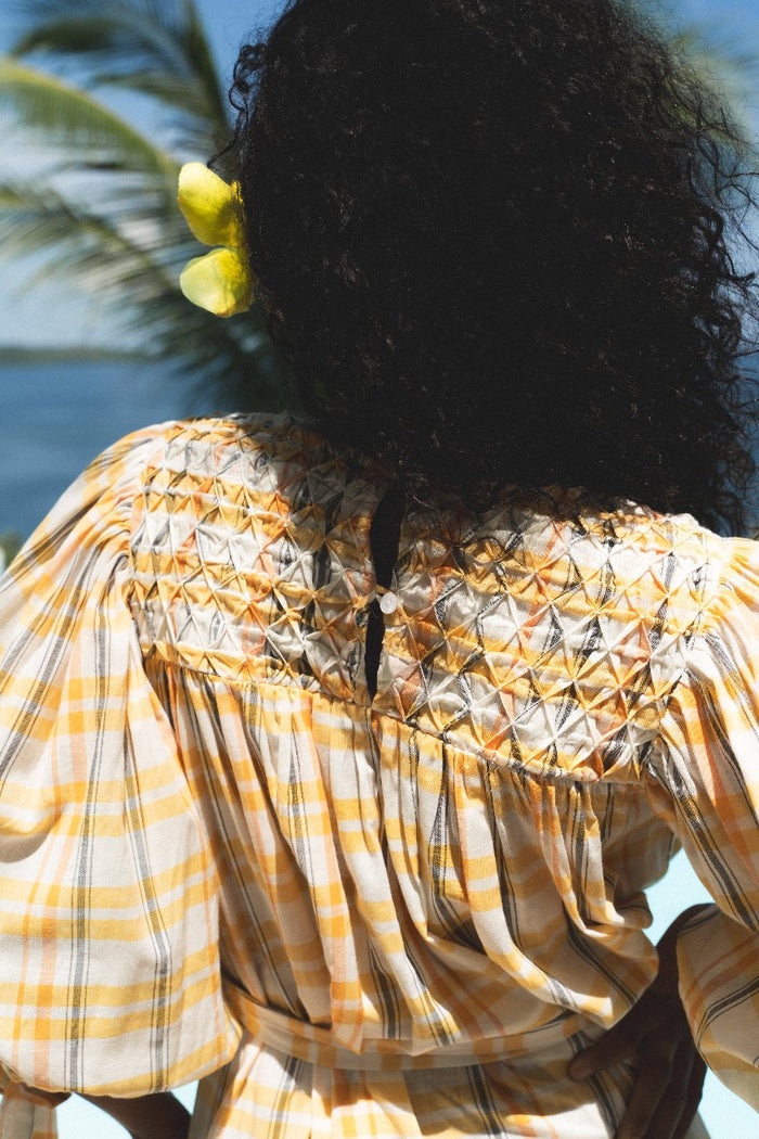 Freya Dress Honeycomb Plaid — back view close-up showing intricate embroidered honeycomb panel at back neckline, handloom woven yellow plaid fabric, Jaipur artisan embroidery craftsmanship | Daughters of India