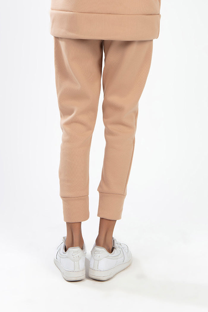 Rear view of the Wild Mushroom Furry Pants Set featuring tan joggers with cuffed ankles and matching oversized hoodie.