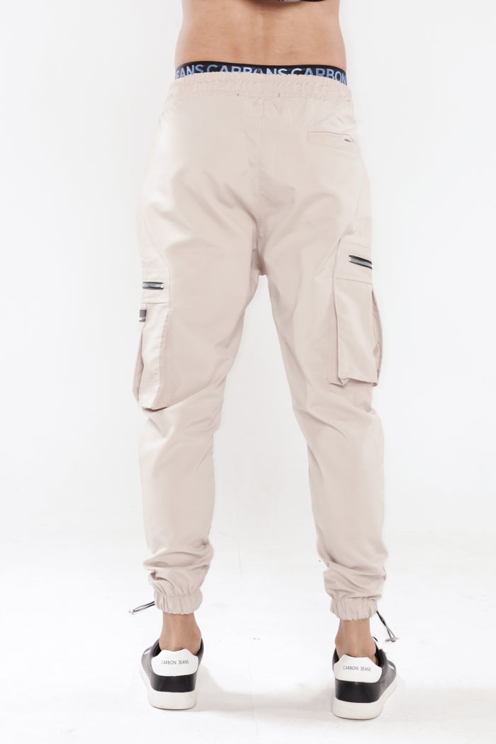 Back view of Gary Cargo Pants in stone with utility zipper pockets and elastic jogger cuffs for men's streetwear style.