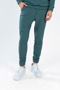 Gordon Two-Piece Pants Set in Carbon turquoise featuring ribbed joggers and white sneakers for urban streetwear.