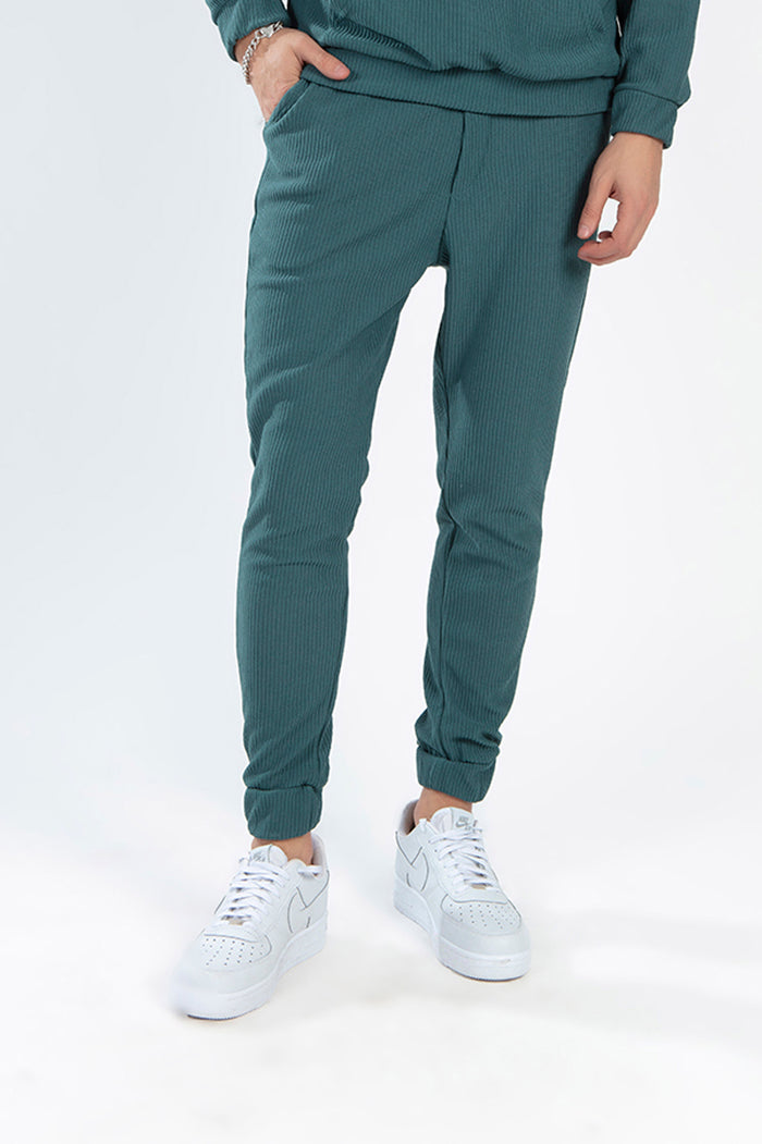 Gordon Two-Piece Pants Set in Carbon turquoise featuring ribbed joggers and white sneakers for urban streetwear.