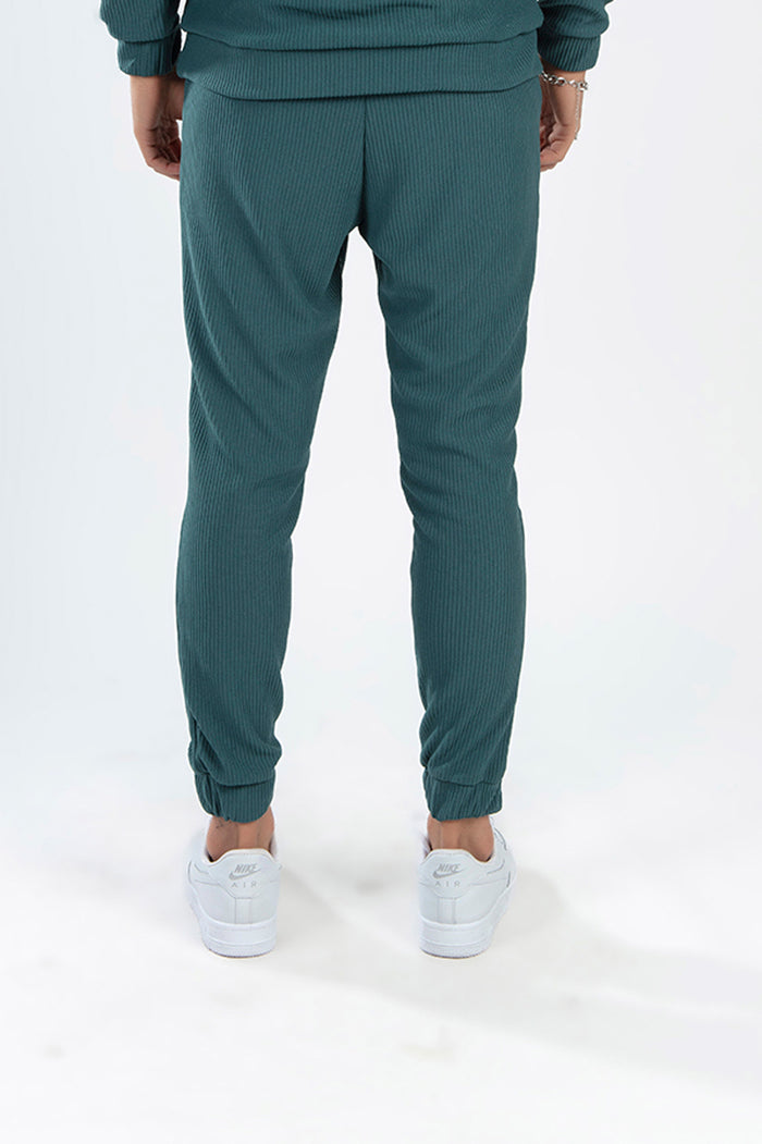 Rear view of turquoise ribbed Gordon Two-Piece Pants Set featuring streetwear joggers and matching top.