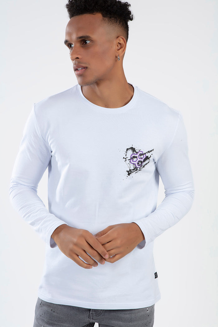 Model in white Heartbit long sleeve streetwear shirt with purple geometric chest graphic and urban slim fit.
