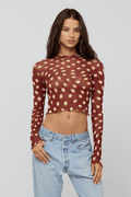 This is an image of Ida Top in Spice - RESA featuring a model wearing the dress