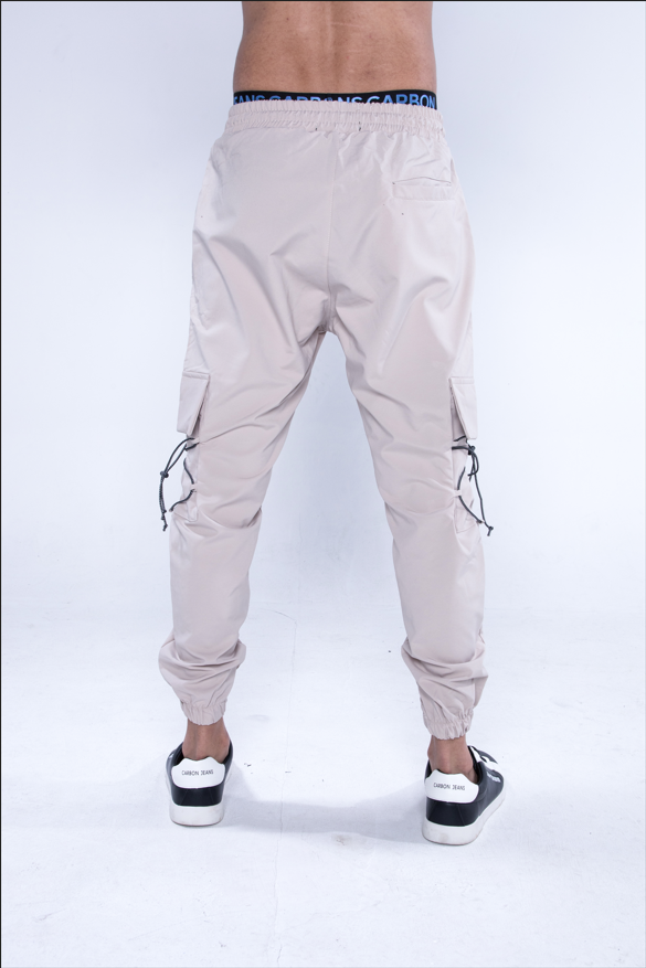 Back view of Jesus Cargo Pants in khaki streetwear style with bungee drawstrings, utility pockets, and jogger cuffs.