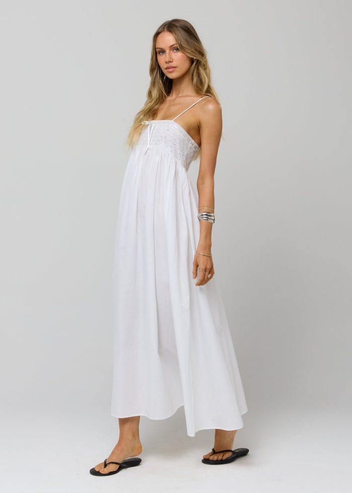 This is an image of Kira Dress in White Eyelet - RESA featuring a model wearing the dress