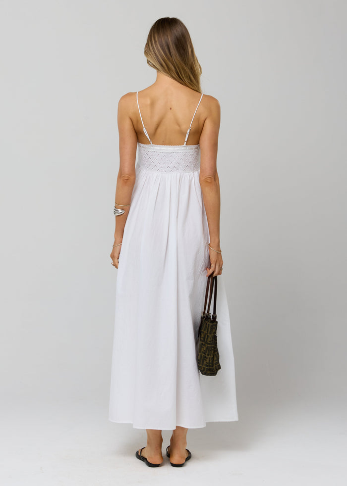 This is an image of Kira Dress in White Eyelet - RESA featuring a model wearing the dress