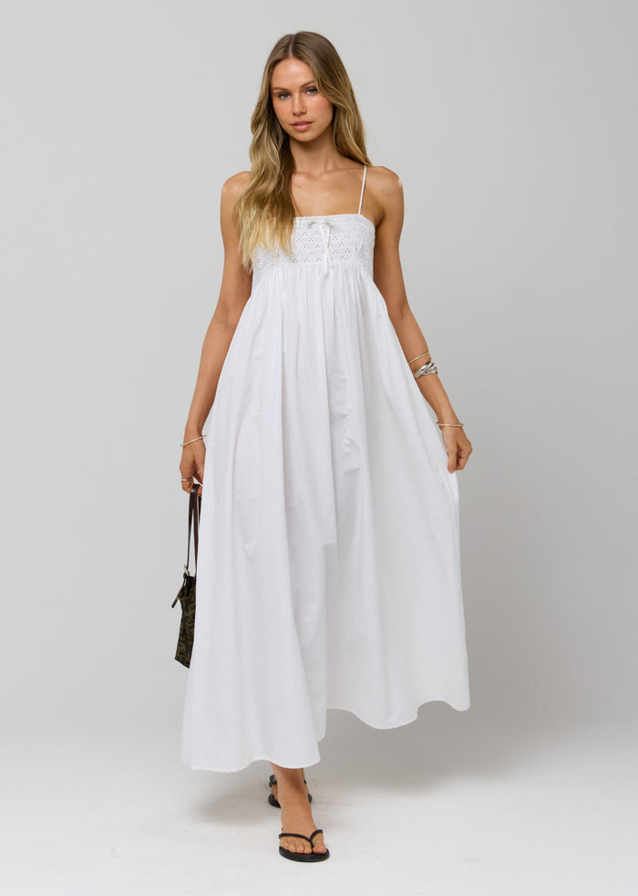 This is an image of Kira Dress in White Eyelet - RESA featuring a model wearing the dress