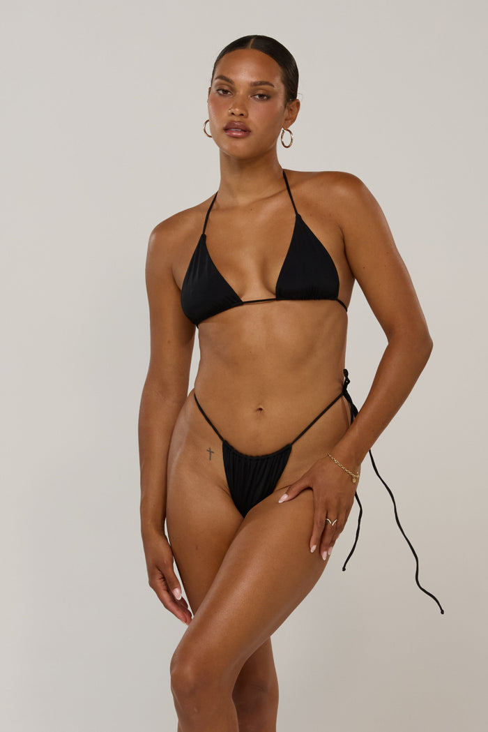 This is an image of Kyle in Black - RESA featuring a model wearing the dress