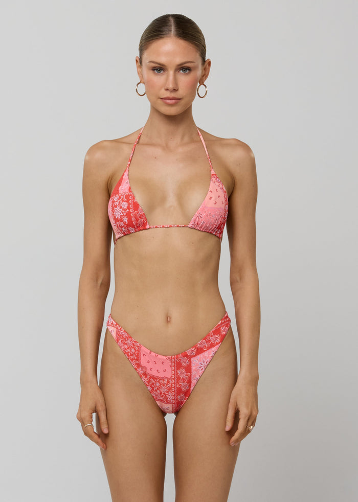 This is an image of Kyle Triangle Bikini Top in Patsy - RESA featuring a model wearing the dress