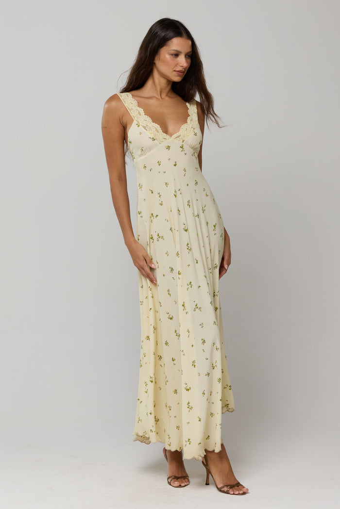 This is an image of Laney Dress in Beurre - RESA featuring a model wearing the dress