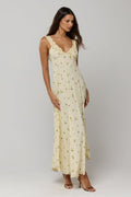 This is an image of Laney Dress in Beurre - RESA featuring a model wearing the dress