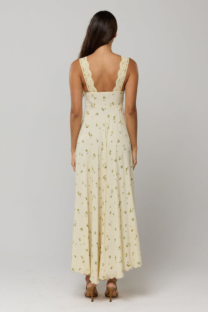 This is an image of Laney Dress in Beurre - RESA featuring a model wearing the dress