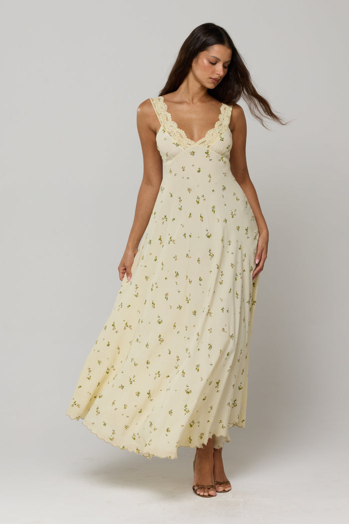 This is an image of Laney Dress in Beurre - RESA featuring a model wearing the dress