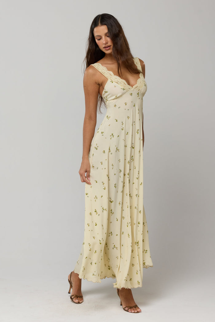 This is an image of Laney Dress in Beurre - RESA featuring a model wearing the dress