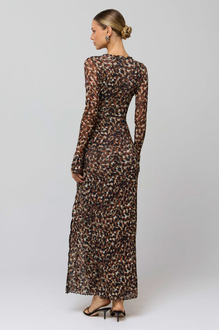 This is an image of Lennon Maxi in Terra - RESA featuring a model wearing the dress