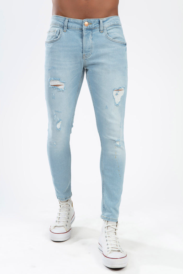Men's Leon light blue super skinny fit distressed jeans with ripped details and streetwear vibe.