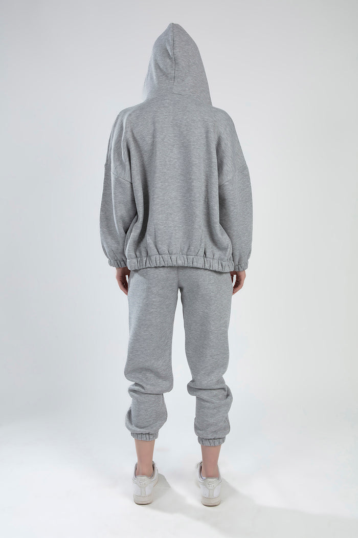 Back view of Lily Jacket Set in light grey heather, featuring oversized hooded jacket and matching sweatpants.