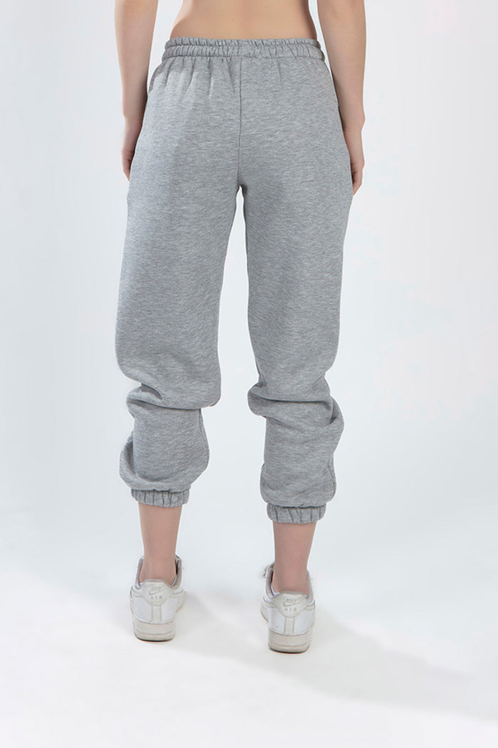 Back view of Lily Two-Piece Pants Set light grey joggers featuring an elastic waistband and cinched ankle cuffs.