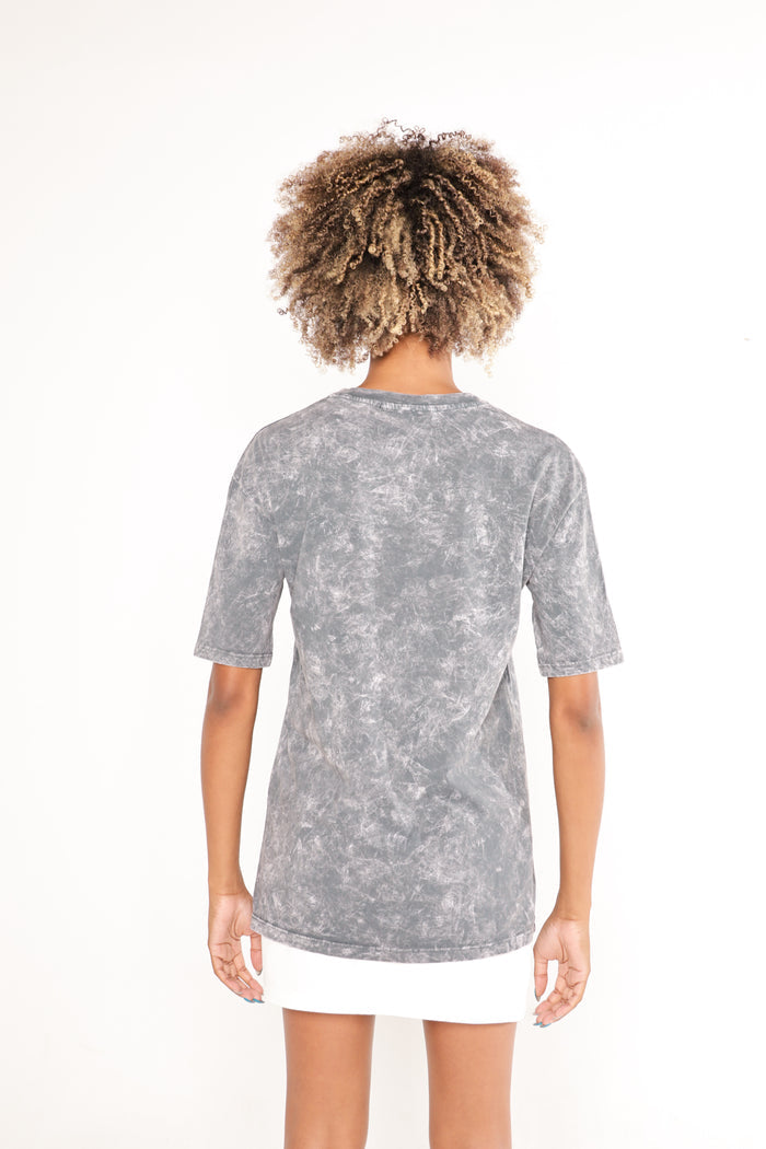 Back view of gray acid wash LOVE TEE on a model, showing the vintage texture and relaxed t-shirt fit.