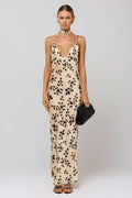 This is an image of Madeline Dress in Black Dahlia - RESA featuring a model wearing the dress