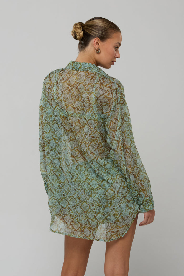This is an image of Maggie set in Azura - RESA featuring a model wearing the dress