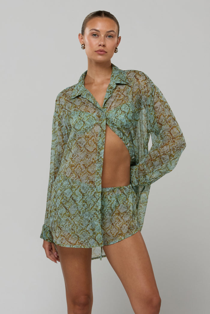 This is an image of Maggie set in Azura - RESA featuring a model wearing the dress