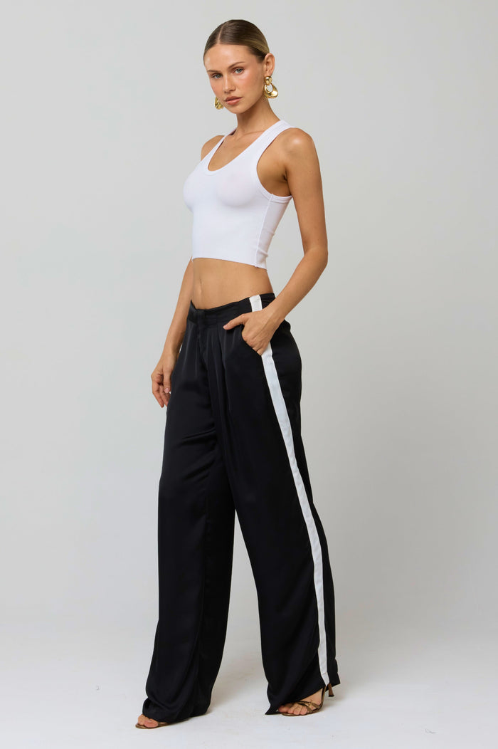 This is an image of Malcolm Trousers in Stripe - RESA featuring a model wearing the dress