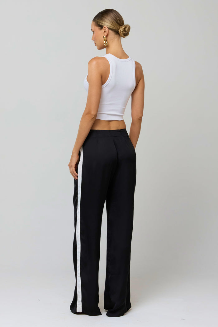 This is an image of Malcolm Trousers in Stripe - RESA featuring a model wearing the dress